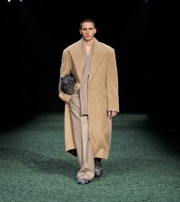 Model in Brushed linen alpaca wool blend tailored coat in clay