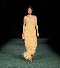 Model in Sequin fringed dress in vanilla