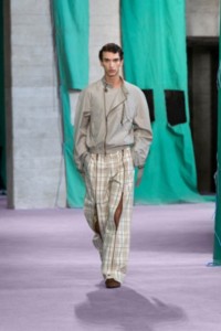 Model wearing Silk poplin Harrington jacket in castle and Burberry Check wool zip trousers in cotton.