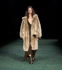 Model in Shearling duffle coat in linden
