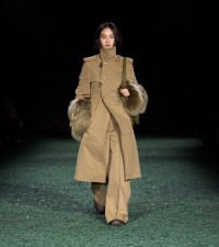 Model in Shearling trim cotton blend moleskin trench coat in beige